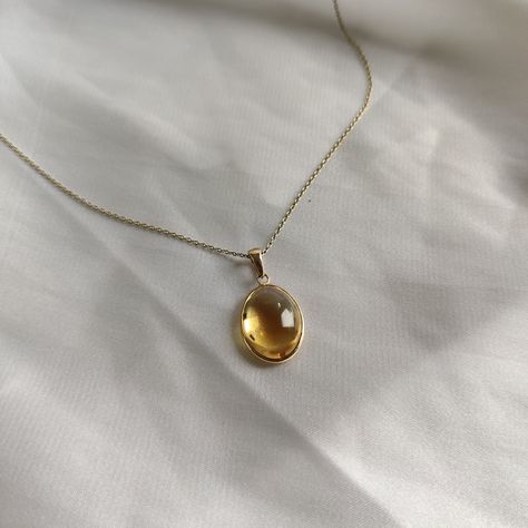 This stunning Pendant is set in 14k Solid Yellow Gold with Natural Citrine with utmost precision. It is a unique gemstone Pendant for nearly every occasion and is completely hassle-free jewelry. ITEM DETAILS: * GEM: Citrine * GEM SIZE: 12X16mm * GEM SHAPE: Oval * Gem Weight: 8.75 carats * Gold Purity: 14KT * Gold Weight: 0.60 gram * Total Weight of the Pendant: 2.35 gram The Gold purity is guaranteed and it comes with authentic 14KT gold hallmark. Since my items are handmade, they are absolutely nickel and lead free. CUSTOMIZATION: * Gemstone customization is available and it can be substituted with a gem of your choice. Kindly message me for the same. PACKAGING * The Pendant comes with layers of safe and secure wrapping along with Free handmade jewelry box with every purchase. ➡️Head to t Topaz Jewelry Yellow, Yellow Jewelry Aesthetic, Gem Stone Jewelry, Sunny Disposition, Yellow Gems, Yellow Hues, Handmade Jewelry Box, Citrine Jewelry, Yellow Necklace