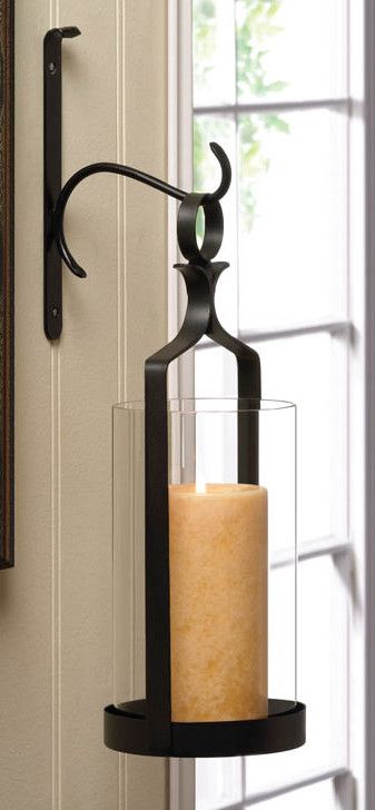 Features:  -Remote candle allowed: Yes.  -Removable glass: No.  Style: -Modern.  Finish: -Black.  Holder Material: -Glass/Iron. Dimensions:  -Fits 4.75" candle.  Overall Height - Top to Bottom: -16". Hanging Glass Candle Holders, Wall Sconces Living Room, Sconces Living Room, Iron Wall Sconces, Decorative Wall Sconces, Rustic Wall Sconces, Candle Wall Sconces, Wall Candles, Interior Wall