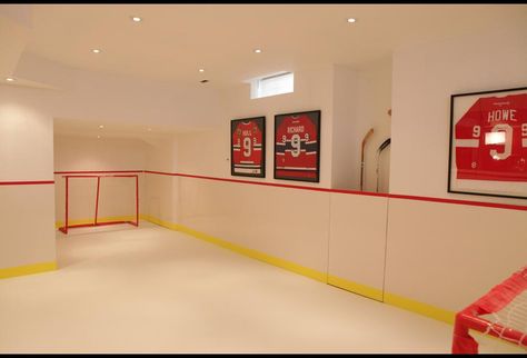 This indoor hockey rink with synthetic ice is the ultimate in cool for a hockey-inspired kid's playroom. Synthetic Ice Rink, Indoor Hockey, Synthetic Ice, Hockey Bedroom, Hockey Room, Sports Court, Home Bar Design, Kids Basement, Man Cave Home Bar