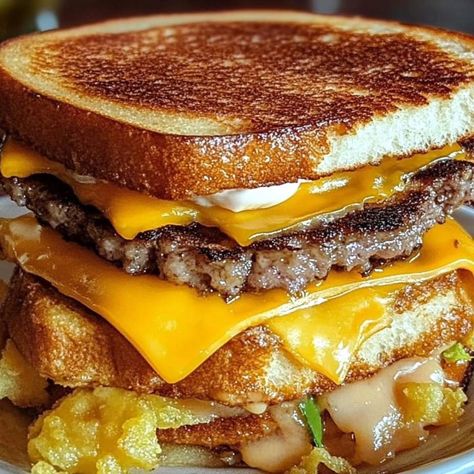 🍔 Big Mac French Toast Sandwich 🧀 Ingredients: • For the French Toast: o 4 slices of thick brioche or Texas toast o 2 large eggs o 1/4 cup milk o 1/2 tsp vanilla extract o Pinch of salt o 1 tbsp butter (for cooking) • For the Filling: o 1/2 lb ground beef (formed into two patties) o 4 slices of American cheese o 4 slices of bacon, cooked until crispy o 1 small onion, sliced into rings o 2-3 slices of tomato o Pickles, to taste o Big Mac sauce (or thousand island dressing) o Salt and pepper to... French Toast Sandwich, Big Mac Sauce, Mac Sauce, Pizza Roll, Thousand Island, Thousand Island Dressing, Texas Toast, Toast Sandwich, Sandwich Ingredients