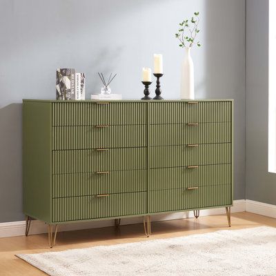 The Manhattan Comfort dumbo Collection brings tasteful modern glam to your home! With its unique vertical ribbed drawer front, full extension and soft close drawers, and stylish splayed metal legs, the collection is not only a true beauty but also made with quality! Stunning variety of colors with sleek metal horizontal handles. dumbo is what you have been looking for all this time! Make your house a home with the dumbo Collection. Color: Green | Mercer41 Gafita 10 - Drawer Dresser 44.64 H x 69. Green Dresser, 5 Drawer Dresser, Tall Dresser, All This Time, Modern Glam, Drawer Design, Manhattan Comfort, Bedroom Furniture Dresser, Double Dresser