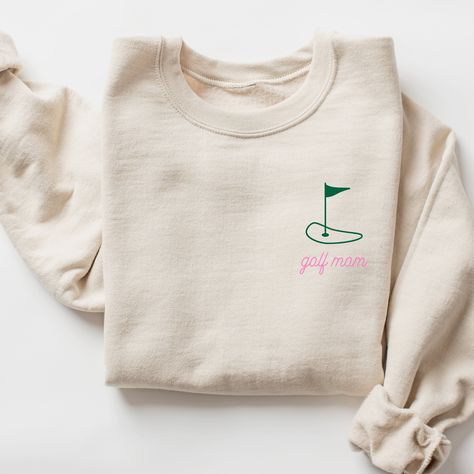 Golf Mom Sweatshirt I love to help my customers with custom orders, if you have a specific request (adding team or club name, bachelorette party personalization, a different sweatshirt color, design on a shirt, or a swap to a Comfort Colors sweatshirt), please message me and I will promptly get back to you! This is a Gildan Sweatshirt with a UNISEX FIT. Please review the size chart in the images before you place your order. If you have any questions about sizing, I would be happy to help! If you don't see the specific color that you are looking for, please message me and I will get back to you quickly. PRODUCTION and SHIPPING Production takes about 1-3 days and standard shipping is 3-5 business days. If you are in a rush, please message me and I can help with shipping upgrades. RETURNS & E Golf Team Shirts, Golf Sweatshirt, Golf Mom, Slp Shirts, Team Sweatshirts, Faith Clothing, Doctor Gift, Gildan Sweatshirt, Comfort Colors Sweatshirt