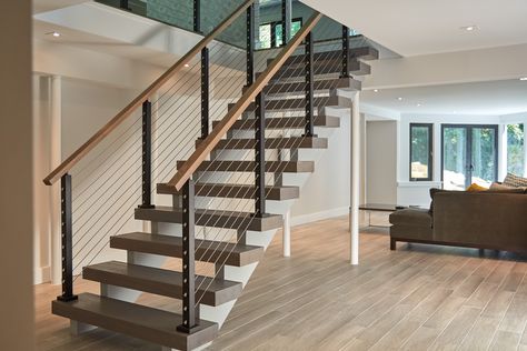 This urban home in New York achieves an open feel with several flights of floating stairs accompanied by cable railing with Aluminum posts. Cable Stair Railing, Banister Remodel, Style Californien, Stainless Steel Cable Railing, Wood Handrail, Handrail Design, Staircase Remodel, Stair Remodel, Floating Stairs