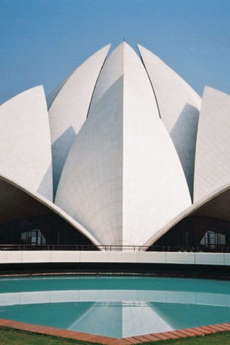 The flower-like shaped lotus stamp can be seen in New Delhi, the capital   of India. Lotus Temple is considered the mother temple of the Indian   subcontinent, can be visited by peoples of all religions. Inspired by   lotus flower architecture Fariborz Sahba, this beautiful building was   designed by India and opened in 1986. Flower Architecture, Huge Door, Architectural Concept, Curved Roof, Beautiful Temple, Lotus Temple, Temple India, Indian Subcontinent, Temporary Structures