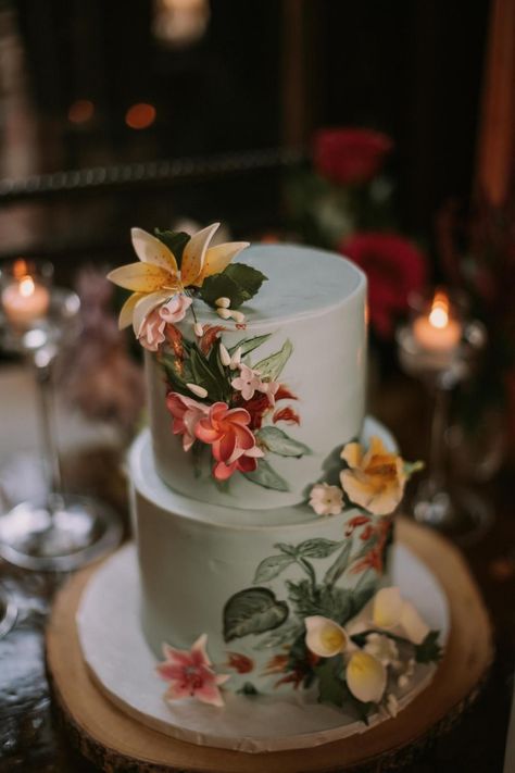 Blue wedding cake with bright beautiful tropical flowers Wedding Cakes Tropical, Tropical Flower Cake, Wedding Cake Forest, Domino Park, Orchid Wedding Cake, Wythe Hotel Wedding, Tropical Wedding Cake, Blue Wedding Cake, Elopement Party