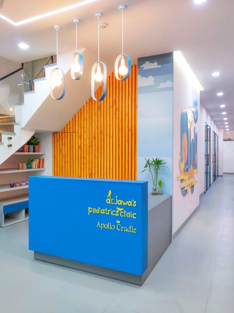 Apollo Cradle Pediatrics Clinic - Healthcare Snapshots Reception Under Stairs, Pediatric Office Decor, Healthcare Snapshots, Children Hospital Design, School Reception, Children's Clinic, Indoor Playroom, Kindergarten Interior, Preschool Designs