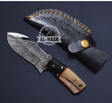 Damascus Gut hook hunting knife. this knife is made of high quality Damascus steel its handle is made of resin with nice protective leather cover. Gut hook hunting knife skinner is used in camping , hunting and also for cuttings and cooking. #DamascusGutHookKnife #HuntingKnife #HighQualityDamascusSteel #ResinHandle #LeatherSheath #SkinnerKnife #CampingGear #HuntingEssentials #OutdoorAdventures #CookingKnife #VersatileTool Hunting Essentials, Hunting Knife, Damascus, Leather Sheath, Damascus Steel, Camping Gear, Leather Cover, Outdoors Adventure, High Quality