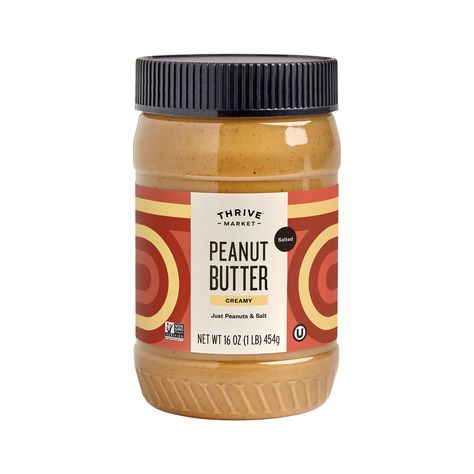 Just 2 ingredients: finely ground non-GMO peanuts & a hint of saltNo added sugars, sweeteners, or preservatives*A feel-good staple ready for sandwiches, sauces, snacks & moreFor ultimate smoothness, stir well before first use, then refrigerate after opening*See nutrition information for fat content. | Thrive Market Creamy Peanut Butter 16 Oz Jar. Peanut Butter Packaging, Butter Packaging, Healthy Grocery Shopping, Peanut Butter Brands, Sugar Packaging, Bday Dinner, Peanut Butter Jar, Organic Peanut Butter, Thrive Market