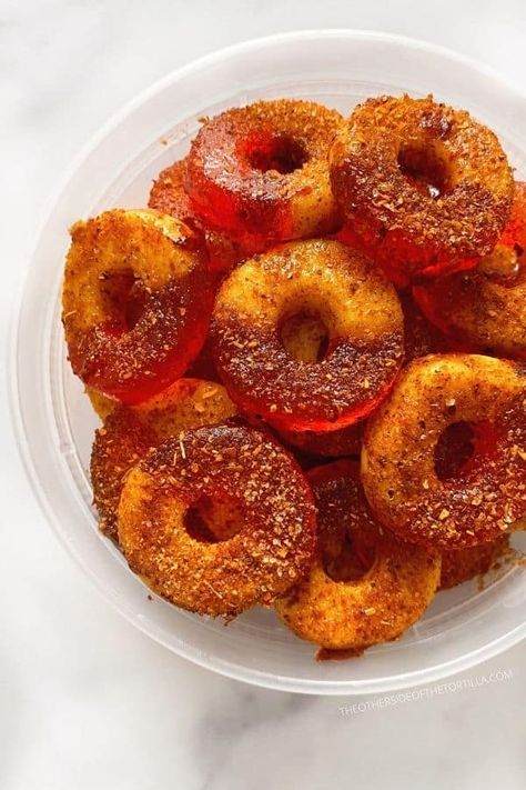 These popular Mexican gummies are soaked in liquid chamoy and sprinkled with Tajín to make a sweet and sour snack. Get the recipe on theothersideofthetortilla.com Chamoy Gummies, Mexican Fruit Cups, Spicy Mexican Candy, Tajin Recipes, Spicy Candy, Gummies Recipe, Bear Recipes, Mexican Snacks, Mexican Candy