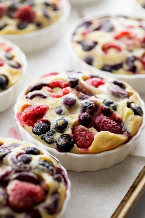 Clafoutis is a traditional, rustic, custard-like, French dessert that uniquely "shows off" summer fruit in the most delicious way possible. And it couldn't be easier to make! This particular version is packed with fresh cherries, raspberries and blueberries, all at their peak of ripeness. Berry Custard, Berry And Cherry, Fresh Cherry Pie, Cherry Recipes Dessert, Almond Coffee Cake, Streusel Bars, Clafoutis Recipes, Cherry Clafoutis, Sweet Whipped Cream