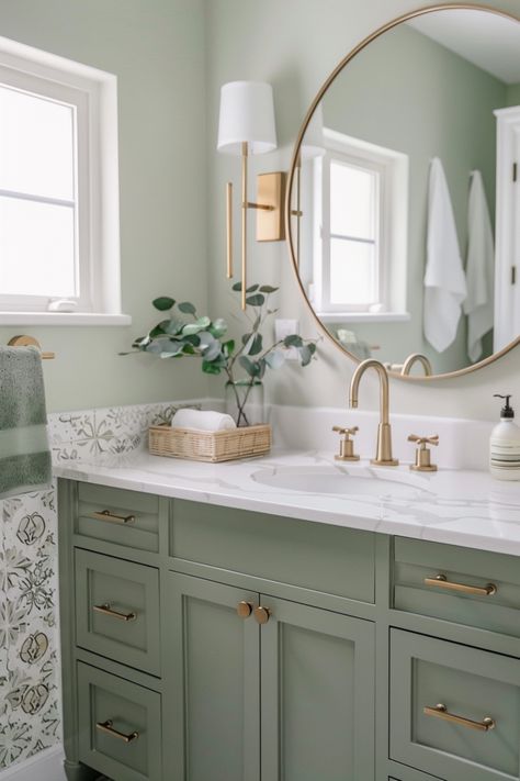 Pair sage green with white accents and natural wood to create a tranquil, spa-inspired bathroom. Click to see more ideas. Bathroom Decor Green Vanity, Sw Sea Salt Bathroom Vanity, Sw Coastal Plain Cabinets, Sage Green Color Palette Bathroom, Green Vanity Bathroom Ideas Paint, Sage Green And Gold Bathroom, Moss Green Bathroom, Sage Bathroom Vanity, Sage Green Bathrooms