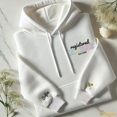 🌟 Proud to be a nurse? Show it off with our stylish and comfy embroidered hoodie! Perfect for dedicated healthcare professionals, this custom piece is personalized with your name and a vibrant heart detail. 🌟 🔹 Order now at toscustom! 🔹 Use code RYBUY10 for a 10% discount! #toscustom #toscustomhoodie #embroideredhoodie #customclothing #registerednurse #nursestyle #nurseapparel #healthcareheroes #personalizedfashion #cozywear #handmadeclothing #medicalapparel #nursepride #nurselife #uniquegi... White Hooded Top With Custom Embroidery, White Long Sleeve Hoodie With Custom Embroidery, White Hooded Sweatshirt With Custom Embroidery, Pink Hooded Hoodie With Custom Embroidery, Registered Nurse Sweatshirt, Nursing Hoodie, Nursing Fashion, Medical Outfit, Nursing Clothes