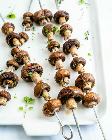 These are the best grilled mushrooms: smoky, tender, and so easy to make! Cook them on skewers, then sprinkle with fresh herbs and lemon. #grilled #grilledmushooms #grill #howtogrillmushrooms #summer #summergrill #plantbased Bella Mushroom Recipes, Baby Bella Mushroom Recipes, Grilled Dinners, Best Grilled Vegetables, Grilled Peppers And Onions, Best Veggie Burger, Grilled Carrots, Grilled Cauliflower, Grilled Avocado