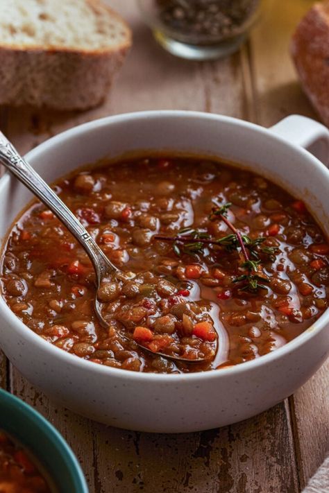 French Lentil Soup | www.oliviascuisine.com | French lentil soup is a hearty and flavorful soup that is perfect for a comforting meal on a chilly day. This classic soup is made with tender green lentils, bacon, aromatic vegetables, and savory herbs, creating a delicious and nutritious dish that is both filling and satisfying. #lentilsoup #lentils #lentil #lentilsouprecipe Hearty Lentil Soup, French Huguenots, Brown Lentil Soup, Green Lentil Recipes, French Lentil Soup, Green Lentil Soup, Celeriac Soup, College Meme, Mediterranean Recipes Healthy