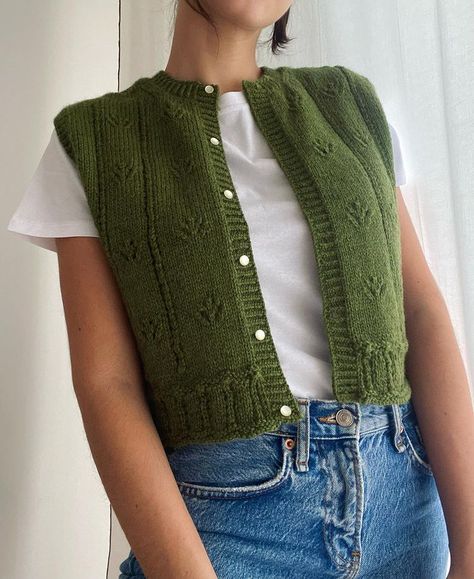 VILMA TOP 🌿 I’m in love with this piece, the details make the vest even more beautiful. What are your thoughts about knitting bottom up? … | Instagram Knitted Vest Pattern, Green Knit Vest, Cropped Knit Vest, Vest Knitting Pattern, Knitted Sweater Vest, Knit Vest Pattern, Handmade Knit, Knit Bottom, Knitted Vest