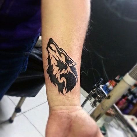 Top 43 Tribal Wolf Tattoo Ideas [2020 Inspiration Guide] Wolf Hand Tattoo, Wolf Tattoo Forearm, Tattoo Calf, Small Wolf Tattoo, Wrist Tattoo Cover Up, Wolf Tattoos Men, Cowboy Tattoos, Wolf Tattoo Sleeve, Cool Wrist Tattoos