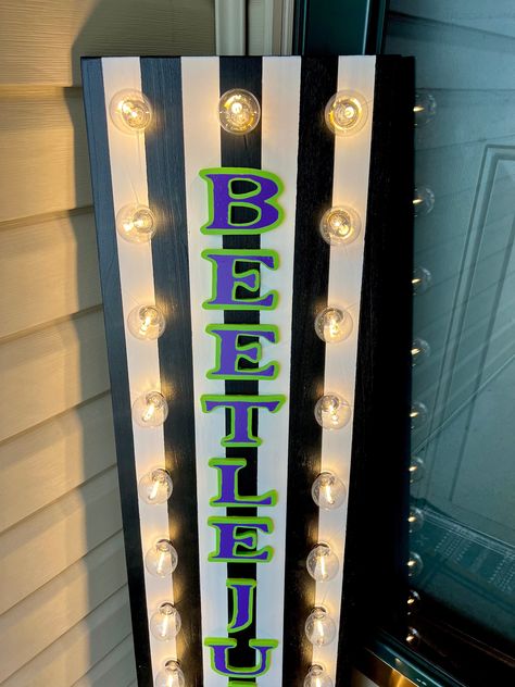 Beetle Juice Halloween Sign. This absolute show stopper comes with 24 G40 lights and is sure to have you ready for spooky season! Use at your front door, as a porch leaner, entryway decor or for any Beetlejuice themed party this year.  Height is approximately 44".  Please note this item is handmade to order and size may differ by up to 1 inch. RETURNS We do not accept returns but please notify us within 48 hours of item delivery if you have any issues with your purchase so we can assist you and keep all packaging and boxes. QUESTIONS? Please message us with any inquiries.  Thank You!  Bright Picks Beetle Juice Sign, Beetlejuice Door Hanger, Beetlejuice Crafts Diy, Bettle Juice Halloween Decor, Beetlejuice Yard Decor, Beetlejuice Theme Party, Beetlejuice Halloween Decorations Diy, Beetlejuice Decoration, Beetle Juice Halloween Decorations