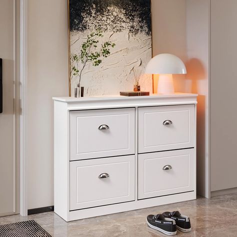 This flip down shoe cabinet, finished in a sleek white with silver handles, offers an elegant and low-key design to enhance any entryway. Equipped with two built-in shoe racks, it provides ample space to accommodate various types of shoes, keeping your entrance clean and tidy. No more shoes piling up behind your door, this shoe bench cabinet offers modern organization to keep your shoes out of sight. Shoe Storage Console, Bench Cabinet, Modern Shoe Rack, Shoe Cabinet Entryway, Modern Organization, Silver Handles, Entryway Console Table, Shoe Racks, Shoe Bench