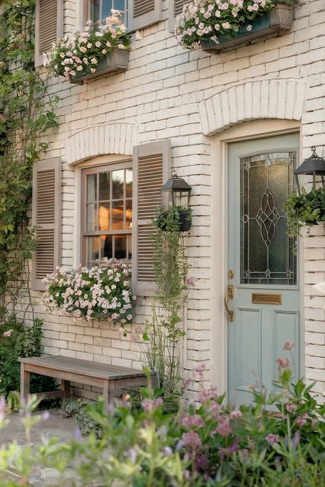 24 Inspiring Vintage Home Exterior Designs: Detailed Guide | by Berhanbicak | Oct, 2024 | Medium Cutest House Exterior, Brick English Cottage Exterior, Updated Victorian Exterior, Outside Cottage House, White And Blue Cottage Exterior, Cute House Ideas Exterior, Colored Brick House Exterior, Painted Brick Victorian House Exterior, Window Design Vintage