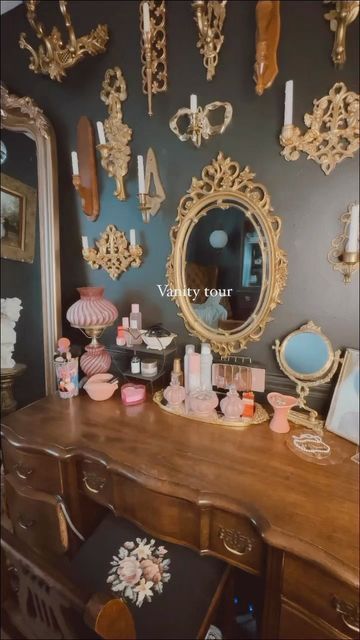 Brittany Elizabeth on Instagram: "Just did a deep clean of my vanity and thought I’d share a little tour 🖤 I love collecting and curating one piece at a time 🖤 . . . #darkinteriors #darkinteriorstyle #darkinterior #blackwalls #eclectichome #maximalism #maximalistinteriors #maximalistdecor #victorianhouse #cozyvibes #cozyhome #cozy #darkeclectic #maximalistdecor #maximalistinteriors #thriftedhome #thriftedhomedecor #thrifted #vintagehome #darkwalls #blackwalls #cozyhome #beautyroom #eclecti Maximalist Vanity Decor, Victorian Maximalism Bedroom, Maximalism Bedroom, Victorian Maximalism, Vintage Candle Sconces, Beauty Vanity, Thrifted Home, Thrifted Home Decor, Makeup Rooms