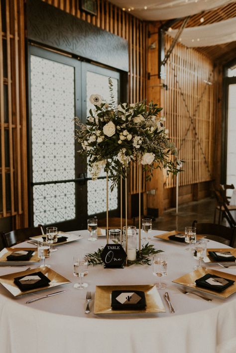 Gold Satin Tablecloth Wedding, Black And White With Gold Accents, Gold Accent Wedding Centerpieces, Black Wedding Gold Accents, Black Wedding With Gold Accents, Black White And Gold Winter Wedding, Gold White Black Wedding Theme, Black Gold Wedding Theme Decoration, Wedding Table Decorations Black And Gold