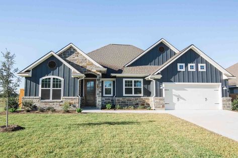 White Craftsman Exterior With Black Trim, Craftsman Style Ranch Homes Exterior, Siding On Ranch Style Home, Exterior Paint Ranch Style House, Blue Ranch Style House, Blue Metal House Exterior, Dark Blue Ranch House Exterior, Blue Vertical Siding, New Ranch Style Homes