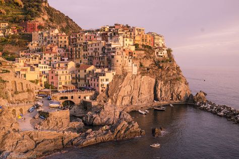 Cinque Terre: The Five Cliffside Villages of the Italian Riviera - This World Traveled Cliffside Village, Painterly Art, Water Wings, Weekend Packing, Italian Riviera, Italian Village, Train Times, Rock And Pebbles, Boat Dock