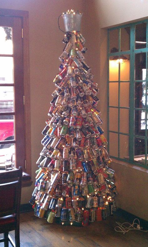 Beer can tree at Percy Street BBQ Beer Can Chandelier, Beer Can Christmas Tree Diy, Beer Tree Christmas, Beer Can Christmas Ornaments, Beer Christmas Decorations, Beer Can Decorations, Beer Can Display Ideas, Beer Cans Crafts Ideas, Beer Can Christmas Tree