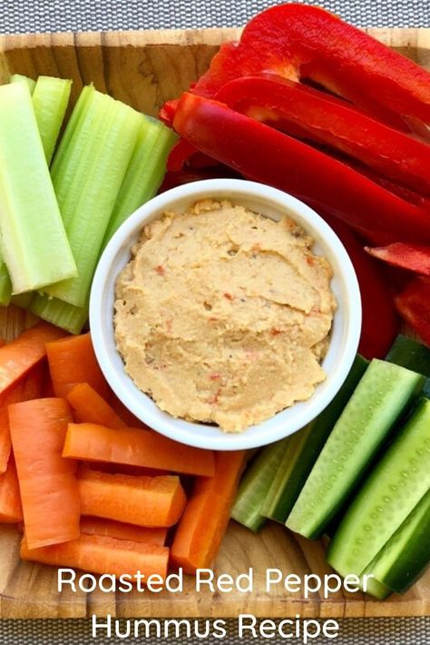 This Roasted Red Pepper Hummus Recipe is great for anyone looking for healthy snack ideas. The delicious homemade roasted red pepper hummus is served with carrots, cucumber, celery and carrots for a healthy snack  Roasted Red Pepper Hummus Recipe  4 cups cooked chickpeas 1/2 cup cold pressed olive oil 1/2 cup tahini paste 4 garlic cloves roasted 1 red pepper roasted 1/2 head cauliflower roasted 1 tsp himalayan salt (or to taste) cold pressed olive oil, salt and pepper for roasting vegetables Roasted Red Pepper Hummus Recipe, Red Pepper Hummus Recipe, Classic Hummus, Cauliflower Hummus, Healthy Hummus, Pepper Hummus, Increase Serotonin, Roasted Red Pepper Hummus, Healthy Afternoon Snacks