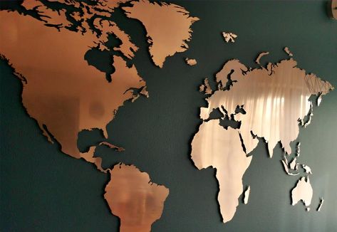 Large copper world map. The product is characterized by a true and very detailed picture of the continents and largest islands of the world. The material used - copper - is a unique metal with a fascinating color and shiny, noble structure. Copper gives the interior warmth and elegance Copper Wall Decor, Gold World Map, World Map Wall Decor, Gold Map, Copper Wall Art, The Continents, Accent Wall Designs, Travel Wall Decor, Living Wall Decor