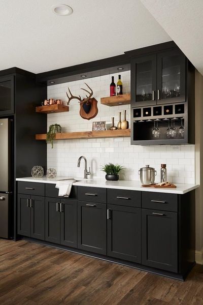 Basement Bar Ideas Black Cabinets, Black Cabinets White Subway Tile, Black Cabinets Wood Shelves, Black Kitchen Cabinets White Countertops Open Shelving, Large Wet Bar Ideas, Black Cabinets Bar Basement, Black Basement Cabinets, Basement Bar With Black Cabinets, Wet Bar Black Cabinets