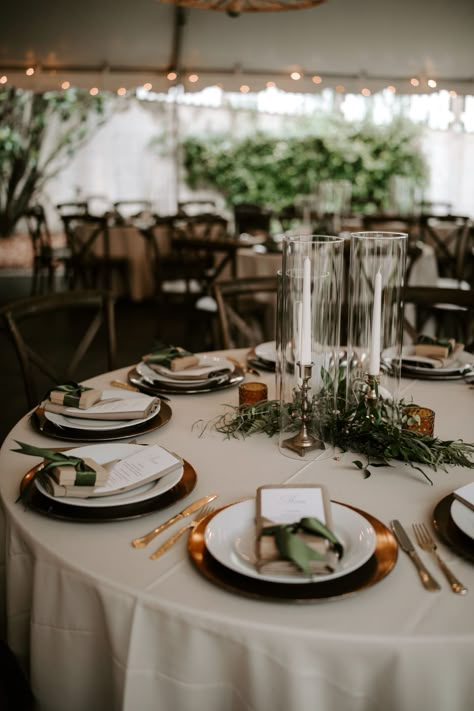 Wedding Fall Table Setting, Greenery Tablescape Round Table, November Wedding Ceremony Decor, Sage Green And Rust Wedding Centerpieces, Wedding Table Setting Round Tables, Wedding Table Setting Ideas Round, Moody Wedding Table Setting Round, Fall Greenery Wedding Centerpieces, Minimal Fall Wedding Decor