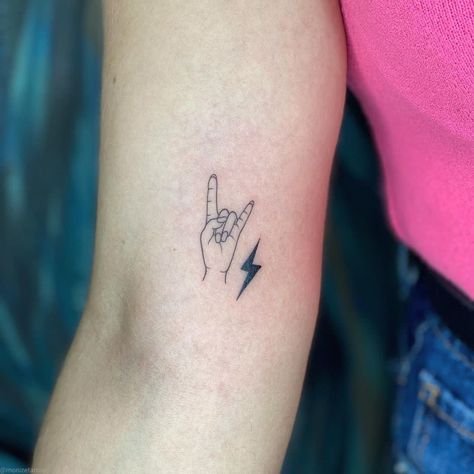 Rock And Roll Tattoos For Women, Concert Ticket Tattoo, Rock N Roll Hand Tattoo, Drum Tattoo Ideas For Women, Minimalist Piano Tattoo, Rock Music Tattoo, Classic Rock Tattoos, Rock Band Tattoos, Rock On Tattoo