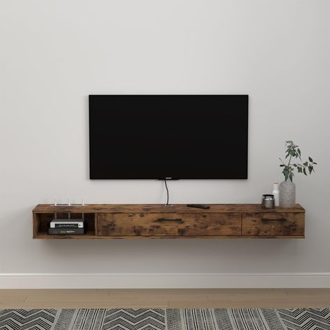 PRICES MAY VARY. [Space-saving & Large Capacity]: Our wall mounted media console is perfect for homes with limited space. With its wall-mounted design, it frees up valuable floor space, allowing you to use the area for other purposes.With 2 doors design provides ample storage space for all your TV accessories. It's perfect for keeping your living room neat and organized. [Easy to Assemble & Clean]: Our floating media cabinet comes with all the necessary hardware and instructions for easy assembl Under Wall Mounted Tv Ideas, Mounted Tv Storage, Tv With Shelf Underneath, Bedroom Mounted Tv, Table Under Mounted Tv, Tv Set Up Bedroom, Wall Mount Tv Console, Under Tv Cabinet, Wall Mounted Tv Ideas