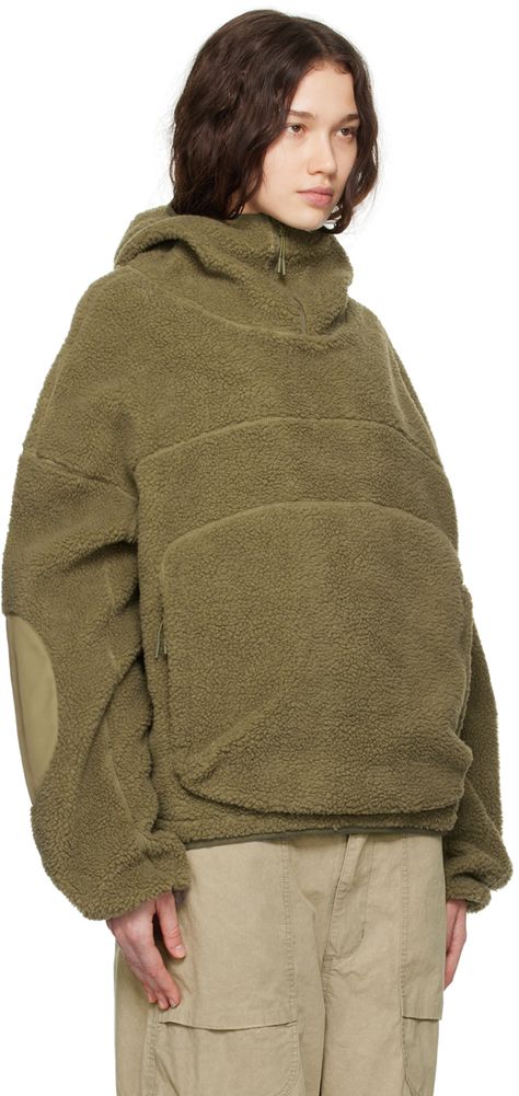 380 gsm polyester sherpa fleece hoodie. · Paneled construction · Zip-vent at hood · Zip kangaroo pocket · Bungee-style drawstring at hem · Dropped shoulders · Ripstop patches at elbows · Elasticated cuffs Supplier color: Laurel Entire Studios, Studio Green, Casual Leather Shoes, Jacket Parka, Cotton Hoodie, Sherpa Fleece, Hoodie Top, Light Jacket, Fleece Hoodie