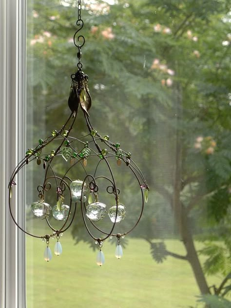 A Melted Marble Sunshower Chandelier by Cassie Bell Wire Chandelier Diy, Suncatcher Chandelier, Wire Chandelier, Crystal Suncatchers Diy, Copper Wire Crafts, Wire Ornaments, Diy Wind Chimes, Deco Nature, Diy Chandelier