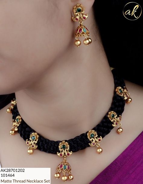 Beautiful thread necklace and jhumka earrings with ruby and emerald work.  WhatsApp messages to 9176125330 for more info.  No calls Thread Necklace Gold, Black Thread Gold Jewellery, Cristal Necklace Jewellery, Black Thread Jewellery Indian, Black Thread Necklace, Ruby Jewelry Necklaces, Simple Necklace Designs, Black Beads Mangalsutra Design, Gold Jewelry Outfits