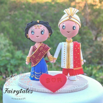 wedding-cake-topper-| The caricatures of the cute wedding couple on the cake top | Every Indian bride’s Fav. Wedding E-magazine to read. Here for any marriage advice you need | www.wittyvows.com shares things no one tells brides, covers real weddings, ideas, inspirations, design trends and the right vendors, candid photographers etc. Couple Indian, Indian Wedding Cake, Blush Wedding Cakes, Big Cake, Wedding Cake Cookies, Big Wedding Cakes, Romantic Rustic Wedding, Square Wedding Cakes, Wedding Cake Alternatives