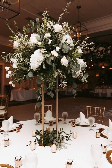 Emerald Green Candles Wedding, Tall Bouquet Centerpiece, Winter Wedding Tall Centerpieces, Fake Wedding Flowers Centerpieces, High Centerpiece Wedding Romantic, Wedding Decorations Elegant Modern, Fresh Flower Wedding Centerpieces, Fake Flowers Wedding Decor, Green And White Flower Arrangements Tall Centerpiece