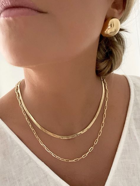 "Embrace timeless elegance this holiday with our 18k Gold Filled Chain Set. Make it uniquely yours or gift it to someone special. Elevate your holiday season with sophistication and sentiment. D E T A I L S - 18k Gold Filled Paperclip and Herringbone Chain  - 4mm Herringbone Chain  - 4mm Paperclip Chain  - Lobster Claw Clasp  ** Explore the versatility of our chains, as they are intentionally not connected, allowing you to wear them together or separately for a customizable and stylish look** Create your own SET:  16\" Herringbone and 18\" Paperclip Chain **pictured**  or  18\" Herringbone and 20\" Paperclip Chain  M A T E R I A L S At Dylan Rae, we are committed to handcrafting jewelry that is perfect for everyday wear. Our high-quality gold filled designs contain 100+ times more real gol Gold Elegant Jewelry, Timeless Gold Jewelry, Stylish Jewelry Gold, Chain Stack, Chain Gold Necklace, Gold Necklace Dainty, Necklace Set Gold, Gold Bracelets Stacked, Jewelry Product Shots