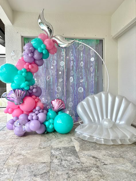 Making a little girls dream come true with mermaid balloons from Organically Arched Mermaid Theme Balloon Garland, Mermaid Birthday Balloon Ideas, Mermaid Back Drop Ideas, Mermaid Birthday Balloon Arch, Mermaid Table Centerpieces Birthday Party, Mermaid Theme Balloons, Mermaid Balloons Decorations, Mermaid Birthday Backdrop Ideas, Mermaid Party Balloon Arch