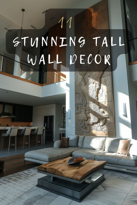 Looking for tall wall decor inspiration? Discover 11 must-have ideas that can bring style and sophistication to your high-ceilinged space. Click to find out which designs could be perfect for you. 🖼️🛋️ #TallWallDecor #HighCeilings #HomeStyling #InteriorDesign #DecorInspo Hallway With High Ceiling, Tall Wall Gallery Ideas, Double Height Room Design, 2 Story Foyer Artwork, Very Tall Ceiling Living Room, How To Decorate Tall Walls High Ceilings Kitchen, House With High Ceilings Open Spaces, High Ceiling Wall Ideas, High Wall Decorating Ideas Living Rooms