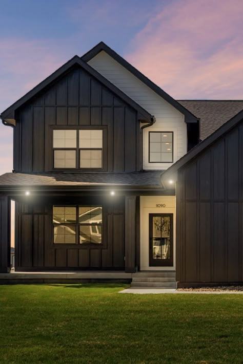 This modern farmhouse is a great example of how to create a striking exterior: a bold, two-tone color scheme; HardiePlank lap siding and HardiePanel vertical siding for visual texture. . Home by Dynasty Homes, Johnston, IA Two Tone Farmhouse Exterior, Two Toned Farmhouse Exterior, Two Tone Cottage Exterior, Two Tone Home Exterior, Two Tones House Exterior, Ironstone Siding Exterior, House With Vertical Siding, Two Tone Modern Farmhouse Exterior, Multiple Siding Exterior