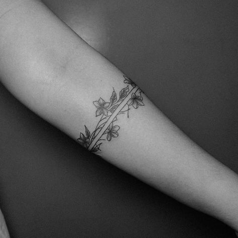 An armband tattoo featuring sampaguita flowers often carries cultural and personal significance. The sampaguita, also known as the Philippine jasmine, is the national flower of the Philippines. It symbolizes purity, simplicity, humility, and strength. In the context of an armband tattoo, it may represent pride in Filipino heritage, a connection to one’s roots, or the embodiment of the qualities that the flower symbolizes. Additionally, armband tattoos can signify continuity, protection, and l... Filipino Arm Band Tattoo, Filipino Tattoos Women, Philippine Tattoo Design, Filipino Tribe Tattoo Women, Sampaguita Flower Tattoo Philippines, Philippine Symbols, Filipino Sun Tattoo Women, Filipino Star Tattoo, Filipino Tattoos Women Traditional