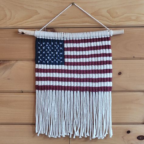 Charming macrame wall hanging to display your patriotism! Made from 4mm cotton cord. Hand embroidered stars. Flag measures 12 1/2 wide by 16 1/2 long; maple hanger is 17 inches wide. Hanger adds 4 inches to total length. For indoor display. Made in Maine Macrame American Flag, Macrame Flag, Flag Macrame, Patriotic Wall Hanging, Patriotic Wall, Embroidered Stars, Macrame Art, Macrame Diy, Hanging Wall