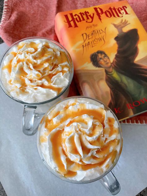 Embrace the magic of the Wizarding World of Harry Potter with this homemade Hot Butterbeer recipe! Indulge in the creamy, caramel-infused goodness of this iconic Harry Potter beverage from the comfort of your own home. With just a few simple ingredients and easy steps, you can create a warm and delightful treat that will transport you straight to the streets of Hogsmeade. Perfect for cozy nights in or themed parties. Grab your wand and get ready to sip on pure enchantment! Hot Butterbeer Recipe, Butter Beer Recipe Harry Potter, Hot Butterbeer, Harry Potter Butter Beer, Butterbeer Recipe, English Toffee, The Wizarding World Of Harry Potter, Creamy Caramel, White Hot Chocolate