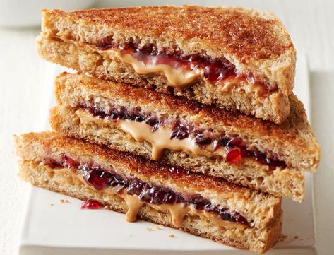 Get creative with your favorite childhood flavor, from frosting and truffles to a salty-sweet snack mix. Peanut Butter Jelly Sandwich, Jam Sandwich, Grilled Sandwiches, Jelly Sandwich, Grain Bread, Paleo Bread, Peanut Butter Sandwich, Peanut Butter And Jelly, Peanut Butter Jelly