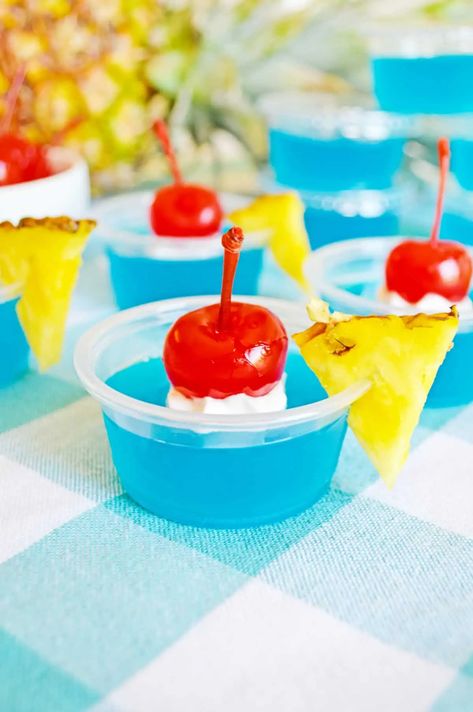 Blue Hawaiian Jello Shots are easy to make with coconut rum and blue curacao, and packed with fruity, tropical flavors. Pina Colada Jello Shots Recipe, Hawaiian Jello Shots, Summer Jello Shots, Blue Hawaiian Jello Shots, Pina Colada Jello Shots, Rum Jello Shots, Lemonade Jello Shots, Easy Jello Shots, Alcohol Ideas