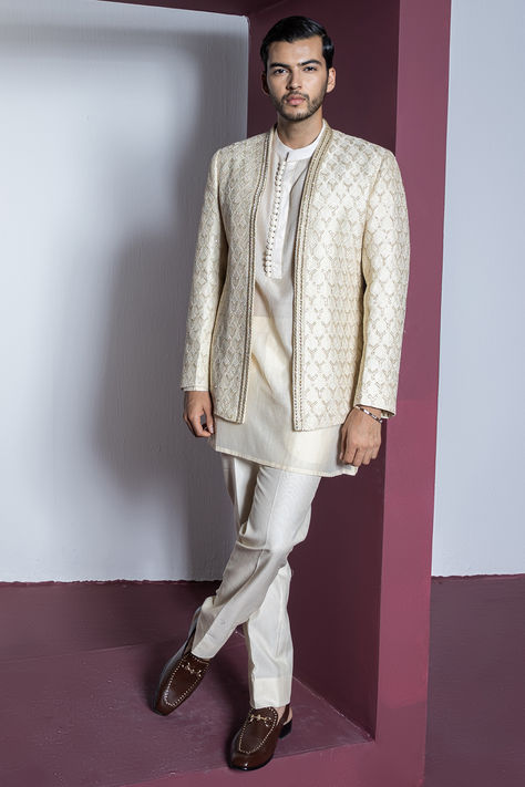 Cream indowestern jacket in pure silk base with hand embroidery. It is paired with a kurta and pants. Perfect for a wedding or engagement ceremony.  #Perniaspopupshopmen #menswear #ethnic #whatiworewastrending #ppuslove #silk #handembroidery #indowesternset #weddingwear #wedding #festival Kurta Koti, Ethnic Poses, Striped Kurta, Men Sherwani, Kurta And Pants, Suits Formal, Stylish Boy, Collar Embroidery, Embroidery Jacket