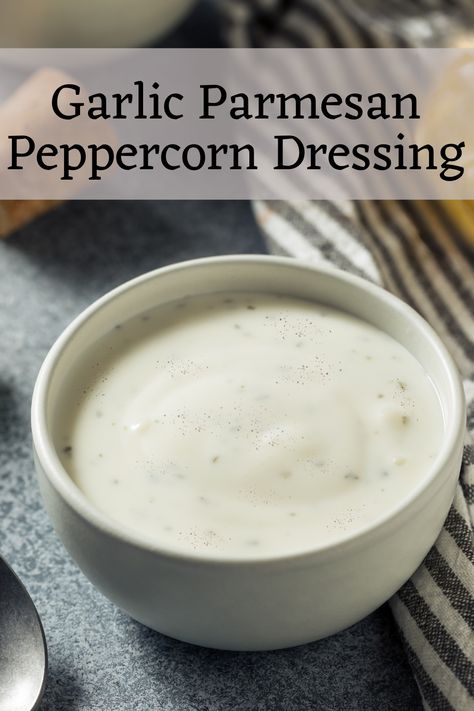 This creamy homemade dressing offers a kick from freshly cracked black pepper, savory garlic, delicious Parmesan cheese, and a slight zing of lemon. Parmesan Peppercorn Ranch Dressing, Pepper Parmesan Dressing, Parmesan Peppercorn Dressing, Peppercorn Ranch Dressing, Peppercorn Dressing, Parmesan Salad, Raw Veggies, Leafy Salad, Peppercorn Sauce